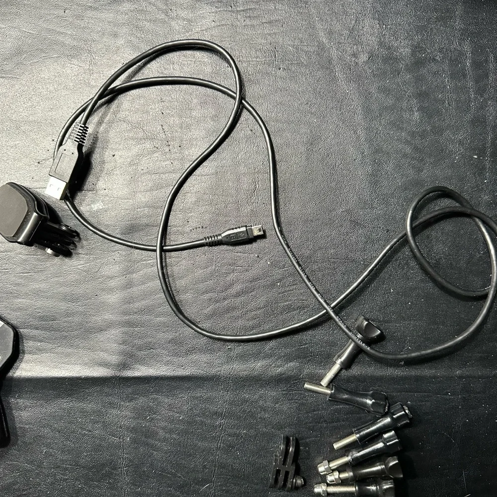 Bundle of Go Pro Head Mount, 3 Stick Mounts , Clip, Charger and Thumbscrews